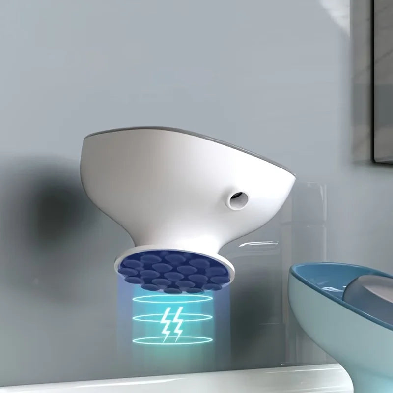 A white leaf-shaped suction cup soap dish is mounted on a wall, with blue electrical arcs visible below it.