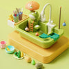 A green electric kitchen sink playset featuring a frog character, running water, and fishing elements for kids.