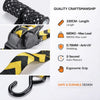 Close-up view of a black and yellow heavy duty retractable ratchet tie-down strap with specifications listed.