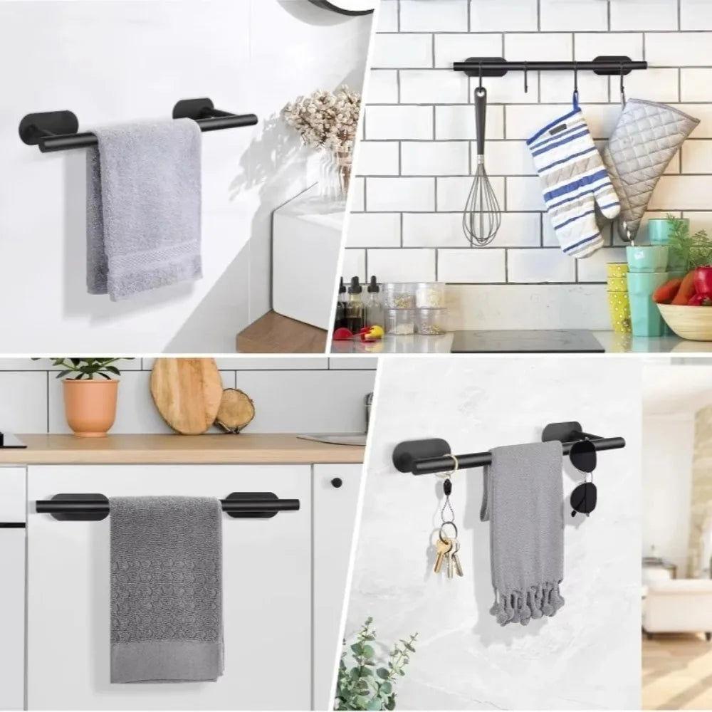 Stainless steel towel holder with a hanging towel and decorative elements mounted on a white subway tile wall.