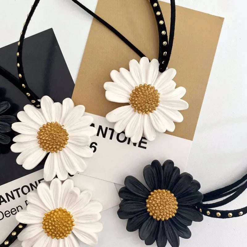White and black silicone daisy molds for fondant, chocolate, and candle making