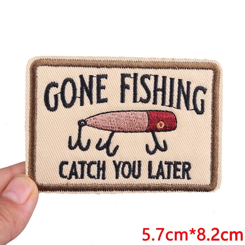A tan embroidered patch with black text that reads Gone Fishing Catch You Later