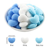 A bowl filled with ten silicone heart beads in blue, white, and baby blue colors.