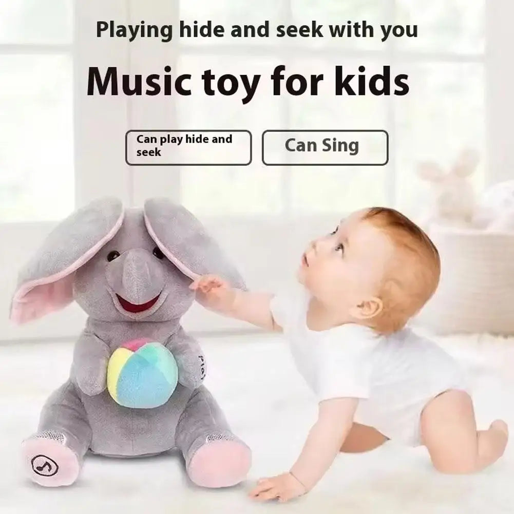 A baby is playing hide and seek with a gray elephant plush toy for kids.