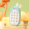 A light blue rabbit-shaped baby music phone toy with a teether rests on a yellow surface next to an orange mushroom.