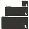 A set of oversized non-slip desk mats in black, showing various sizes like 220x180mm, 800x300mm, and 900x400mm.