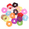 A collection of colorful acrylic spacer beads in various shades including red, pink, yellow, green, and purple.