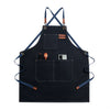 Dark blue professional chef apron with cross-back straps and multiple tool pockets