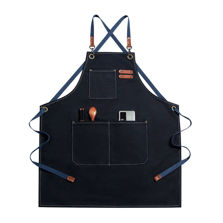 Dark blue professional chef apron with cross-back straps and multiple tool pockets