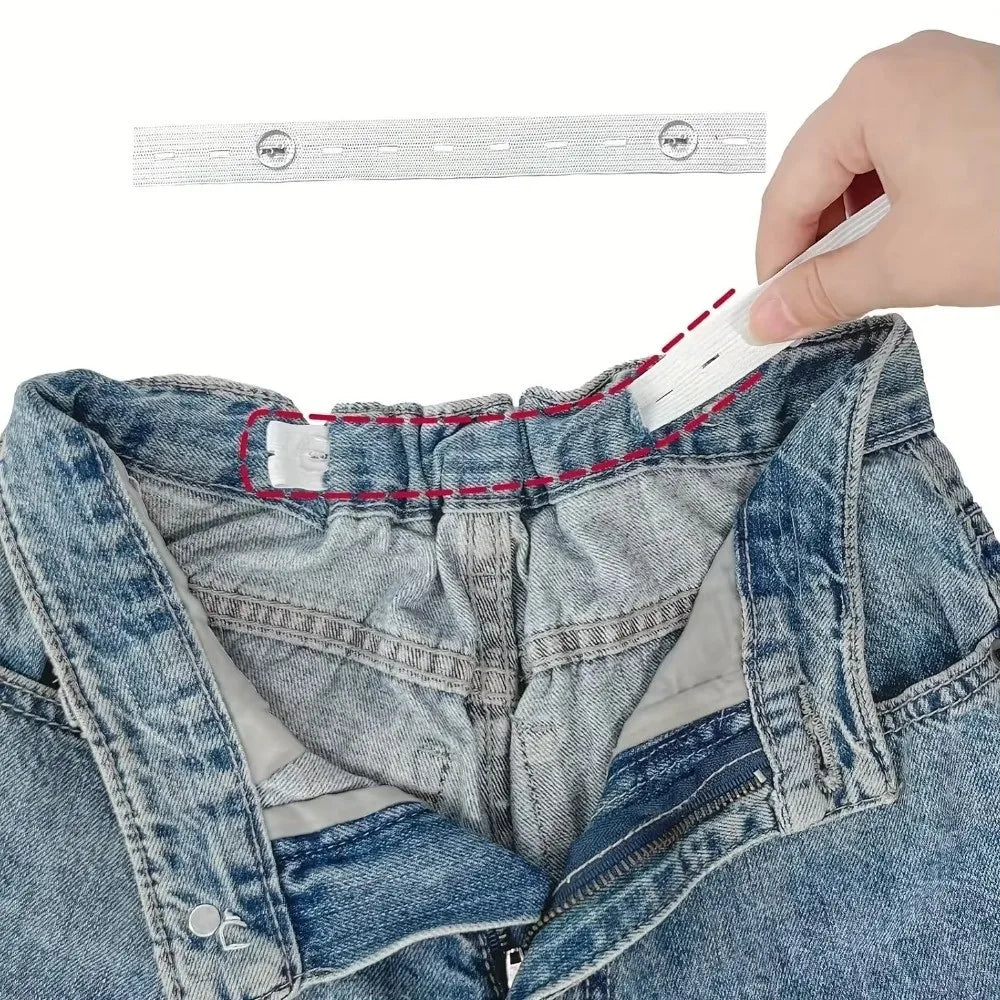 A hand is attaching an adjustable invisible belt tightener set to the waistband of blue denim jeans.