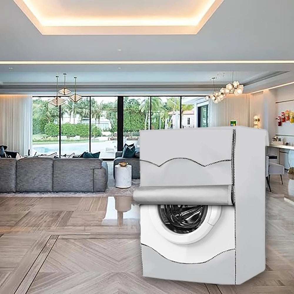A white waterproof washing machine cover with a silver sun protection element is displayed in a modern interior setting.