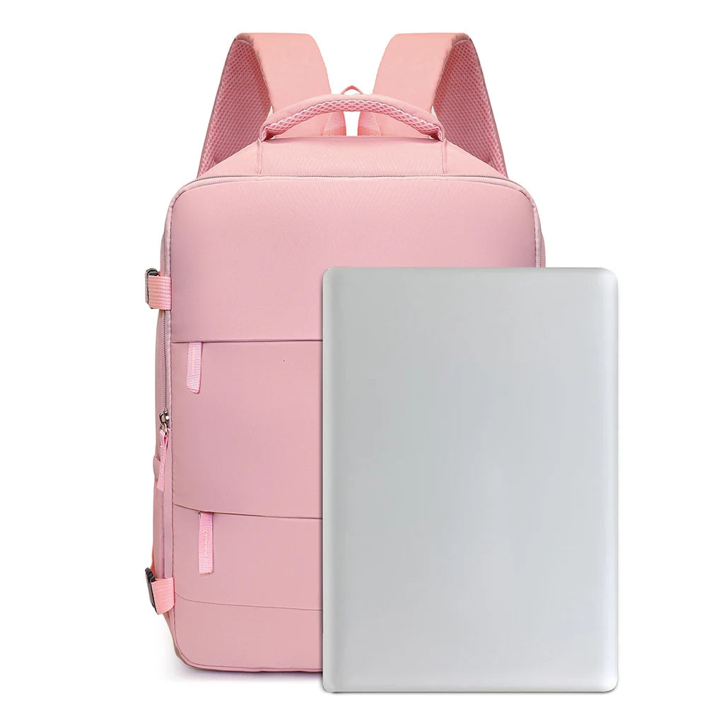 A pink compact cabin travel backpack with a laptop sleeve is shown.