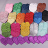 A collection of five heart-shaped iron-on embroidered patches in various glitter colors including pink, green, purple, gold, 