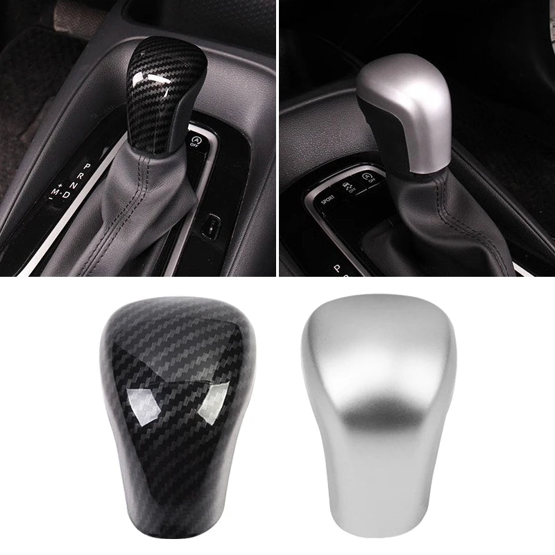 Carbon fiber gear shift knob covers in black and silver for Toyota Camry and Corolla vehicles