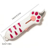 A white retractable cat paw utility knife with pink accents and a silver blade.