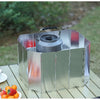 A portable aluminum alloy windshield is displayed on a wooden surface with fresh fruit nearby.