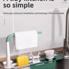 A white telescopic sink rack holding a wet cloth and a yellow sponge in a kitchen sink.
