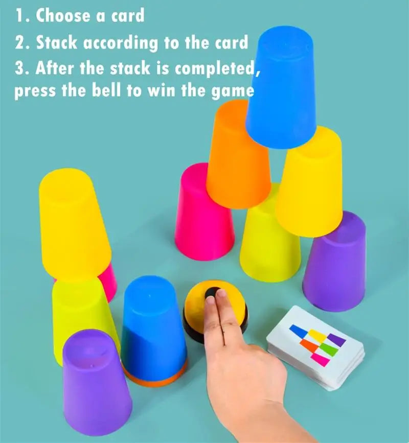 A hand is stacking colorful plastic cups of various sizes and colors, with an activity card visible nearby.