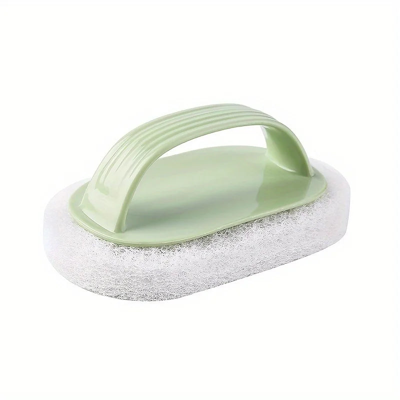 A light green magic sponge scrubber with a long handle resting on a white foam pad.