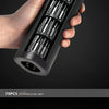 A hand holds a black precision screwdriver set with multiple screwdriver bits inside the magnetic case.