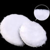 A set of white wool polishing discs for car detailing.