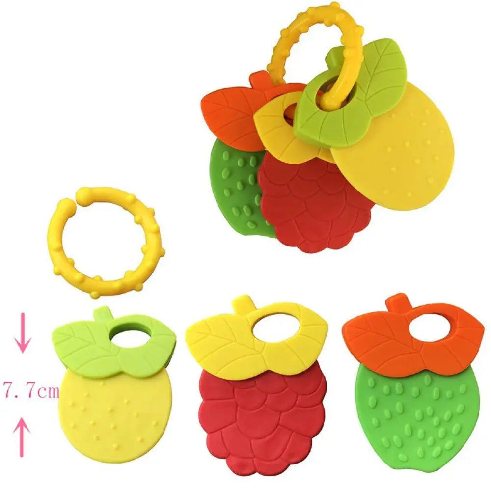 A set of silicone fruit teethers and rattles in various colors including orange, yellow, green, and red.