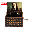 A wooden music box with a dark cover featuring a portrait and an Eiffel Tower, set in a rustic wooden box.