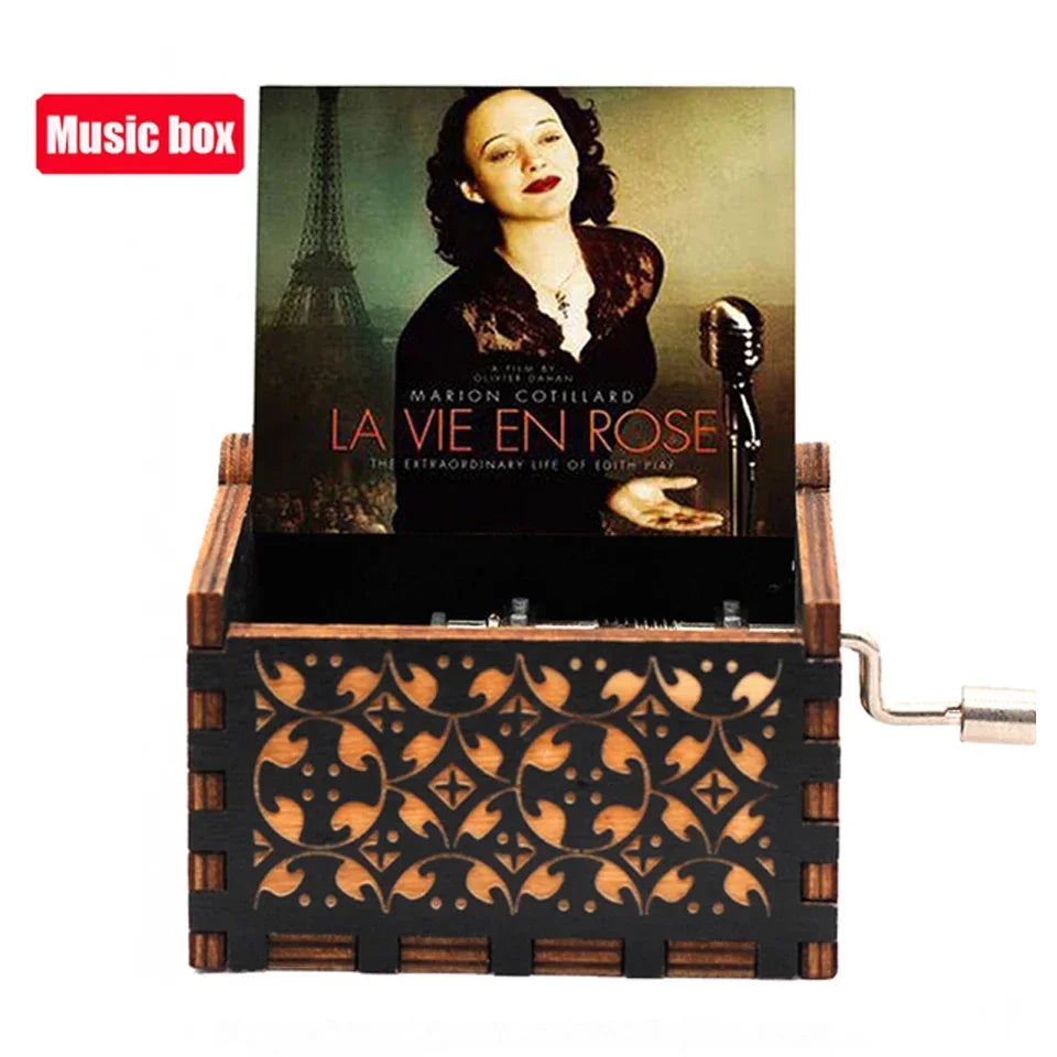A wooden music box with a dark cover featuring a portrait and an Eiffel Tower, set in a rustic wooden box.