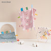 Pink baby sensory tag comfort blanket with white swan embroidery and colorful tags