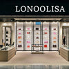 A retail display of women's three-layer leather shoulder bags with crossbody straps on white shelving.