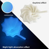 A white 3D illusion fidget star toy demonstrating daytime and night light absorption effects.