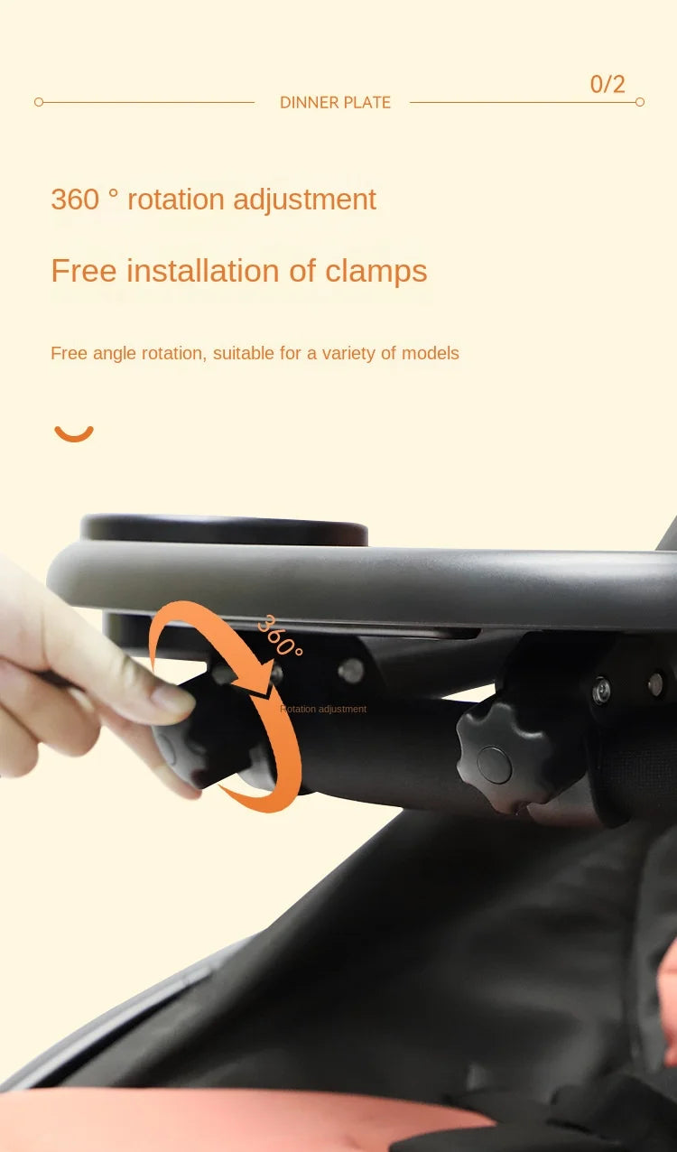 A hand adjusts the 360 degree rotation of a black stroller snack tray with clamps.