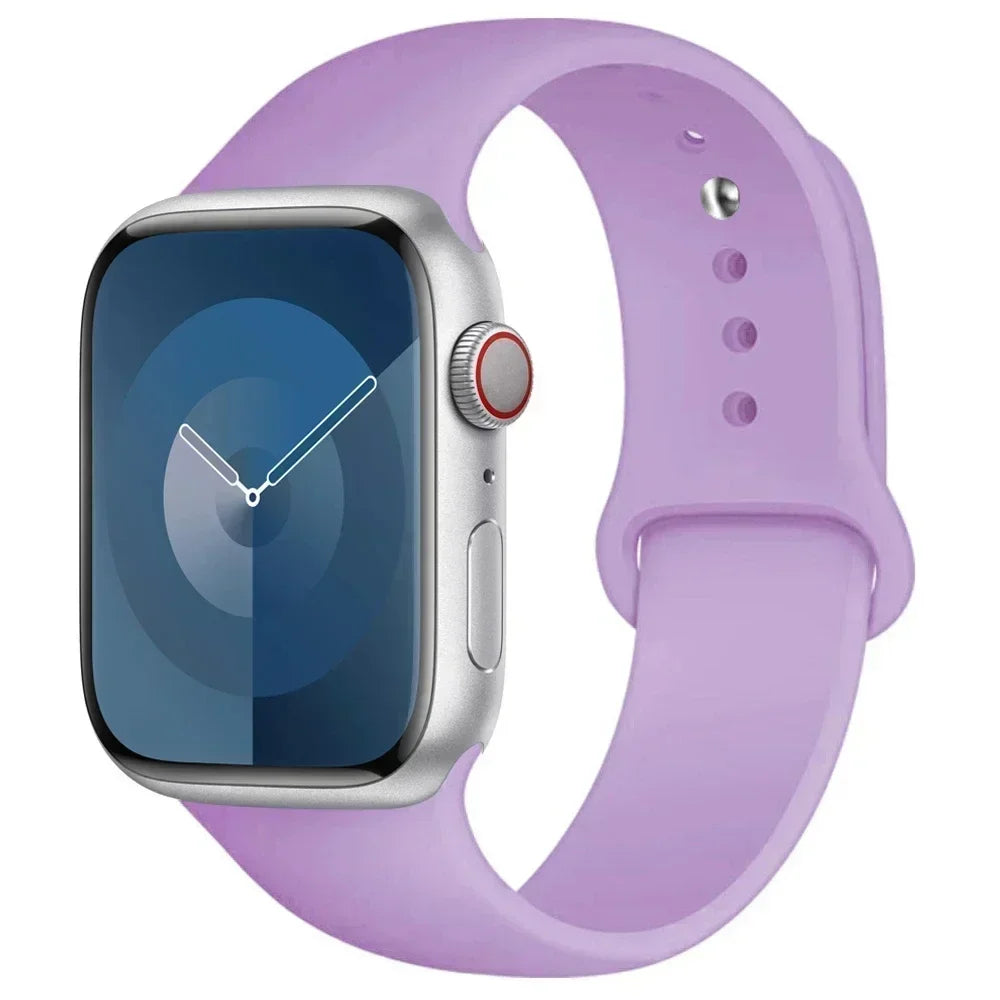A purple silicone sport band is shown alongside an Apple Watch, displaying a blue screen.