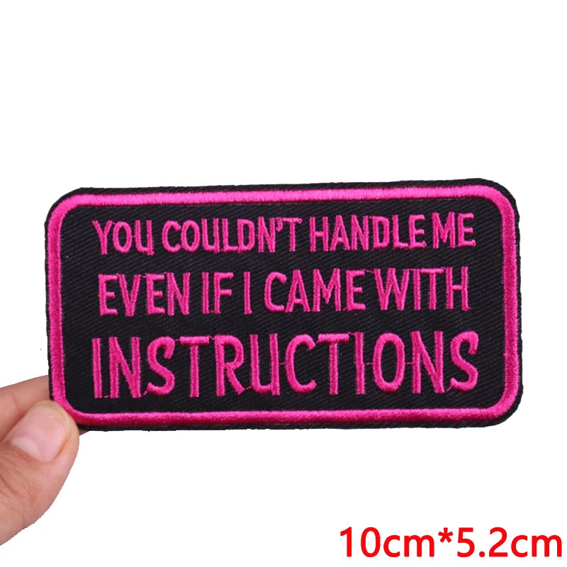 Black embroidered iron-on letter patch with pink text that reads You couldn't handle me even if I came with instructions