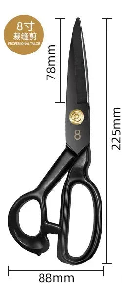 A pair of black professional heavy-duty fabric shears for tailoring and leatherwork with a gold-colored marking.