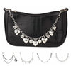 Black crocodile print handbag with a silver chain strap and decorative charms