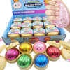Eine Ansammlung glitzernder Dumpling-Squishy-Fidget-Spielzeuge in verschiedenen Farben und Formen in einer Box.
