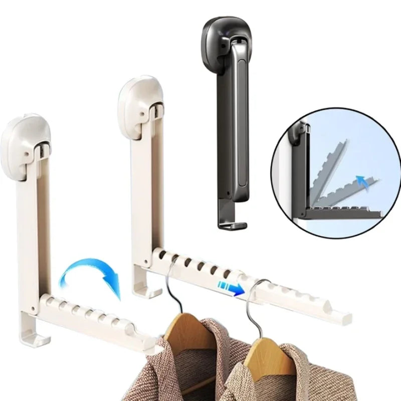 A foldable wall-mounted clothes drying rack with an adhesive mount and a hanging clothes item.