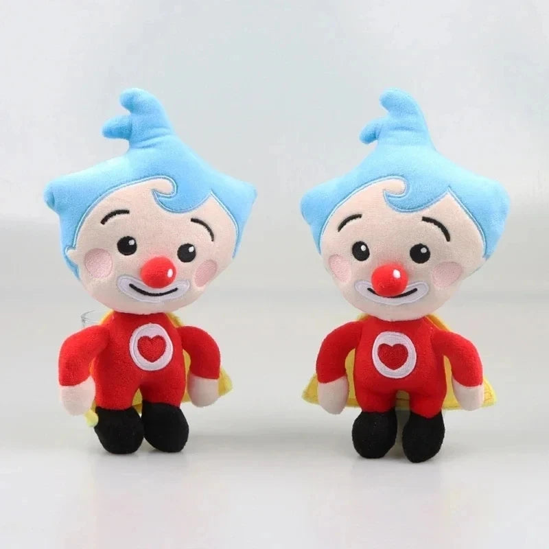 A pair of soft plush toys depicting a blue-haired clown with red accents and a heart shape on the chest.