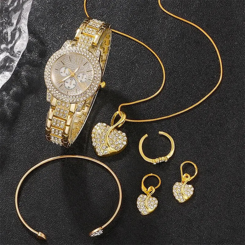 A gold rhinestone watch and jewelry set featuring a watch, necklace, and earrings displayed on a black background.