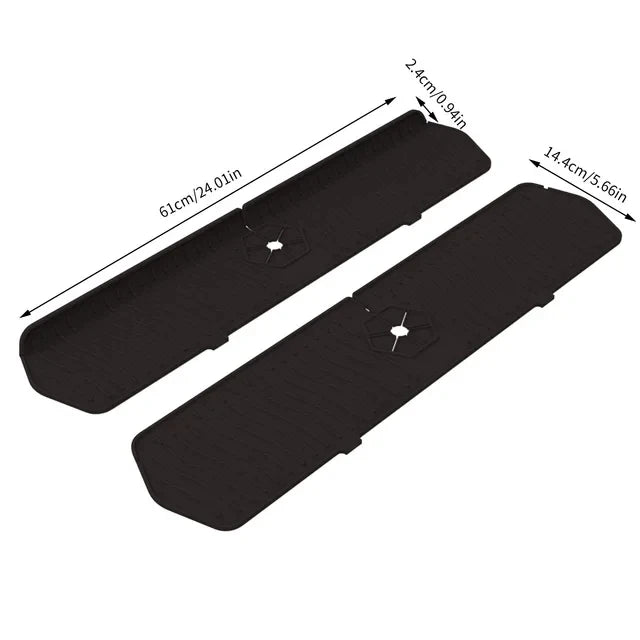 A black silicone faucet mat with a self-draining tray shown from above.