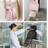 A pink portable hanging toiletry bag is shown on a wall rack and being used by a woman in a bathroom setting.