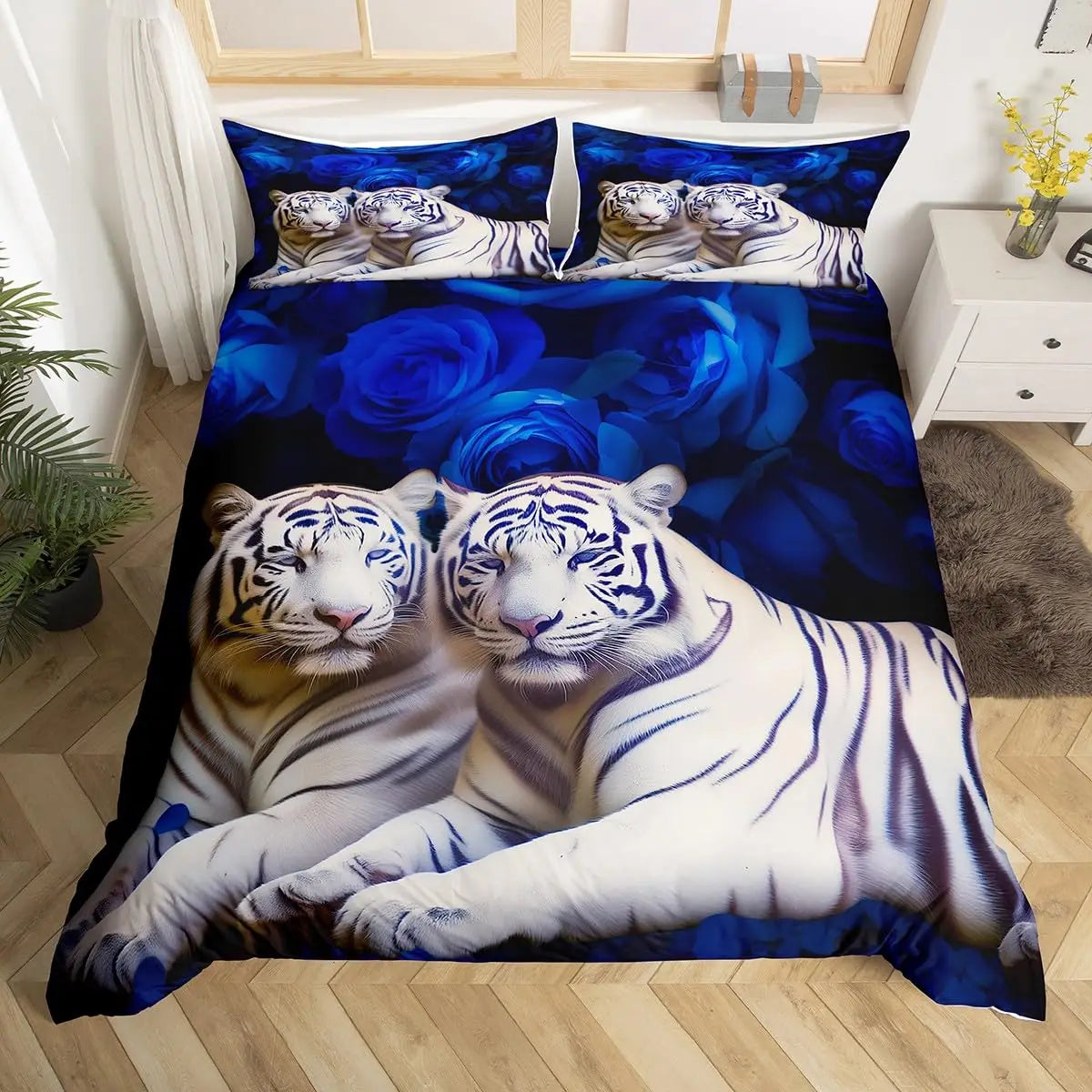 A duvet cover set featuring a pattern of white and blue tigers on a dark blue background.