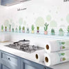 A white kitchen splashback featuring a decorative border of green potted plants and light blue accents.