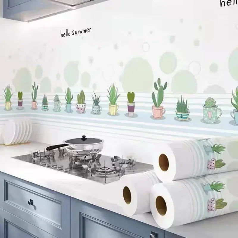A white kitchen splashback featuring a decorative border of green potted plants and light blue accents.