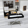 A black 1:12 scale dollhouse piano with a bench displayed on a silver stand.