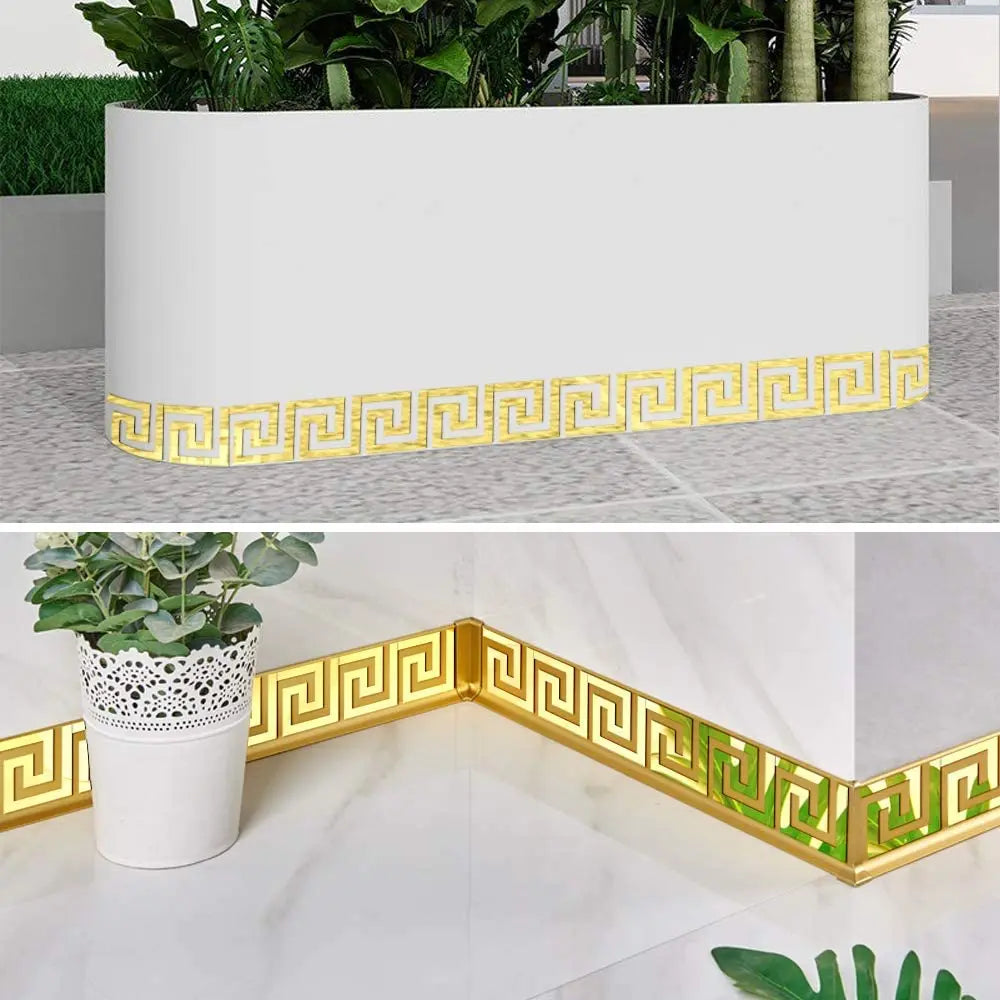 Gold patterned acrylic mirror wall stickers used as decorative edges and borders for a planter box.