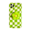 A lime green and white checkered phone case featuring a yellow flower design.