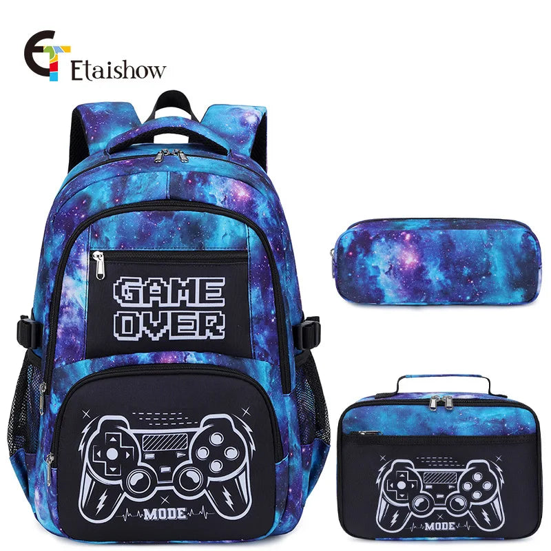 A blue and purple patterned backpack set including a lunch bag and pencil case with a Game Over design