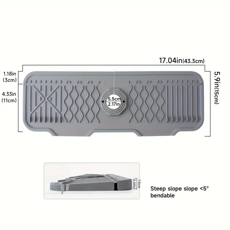 Gray non-slip silicone kitchen sink mat with a drain tray and foldable design